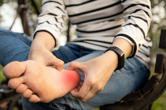 Plantar fasciitis,asian young woman holding her feet and massage with her hand suffer from tendon inflammation,female people sore foot,heel pain,leg fatigue,health problem, plantar fasciitis concept