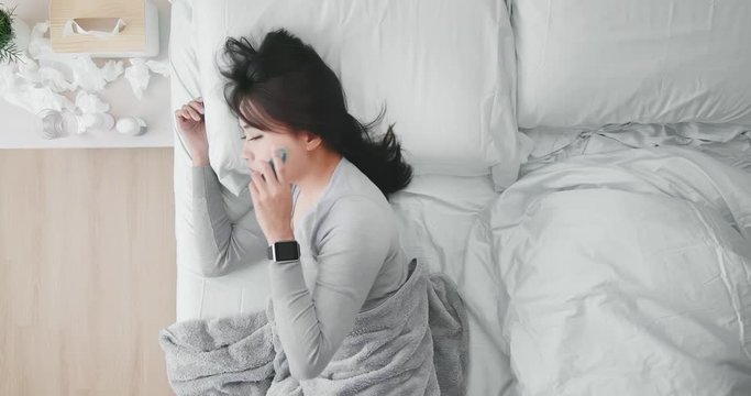 woman sick and has fever