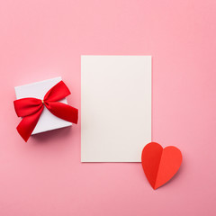 Valentines gift boxe, white card, red bow and felt hearts