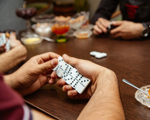 man playing dominoes at the tea house