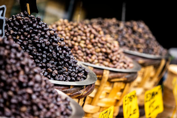 varieties of olives in a natural basket