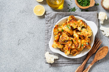 Vegetarian food. Baked cauliflower with herbs and parmesan cheese.