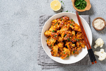 Buffalo Cauliflower . Popular Baked Cauliflower with barbeque sauce. Barbecue Cauliflower Wings . Vegan Food.