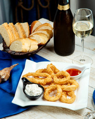 fried calamari served with mayonnaise and sweet chili sauce, white wine and bread
