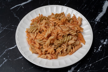 Penne pasta on a plate with sauce