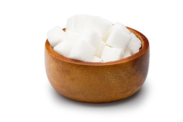 Cube granulated sugar in a wooden bowl on a white background with clipping path.