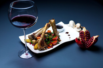 lamb ribs kebab with grilled vegetables, served with red wine © Kamran