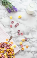 Fototapeta na wymiar Flat lay bowl of colorful breakfast cereals.