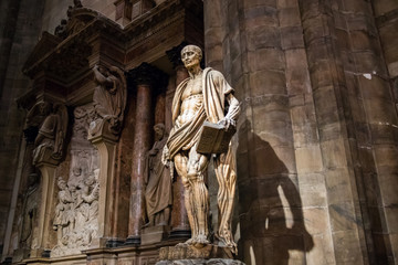 Milan, Italy - March 8, 2019: Statue of St. Bartholomew Flayed was one of 12 Apostles and an early...