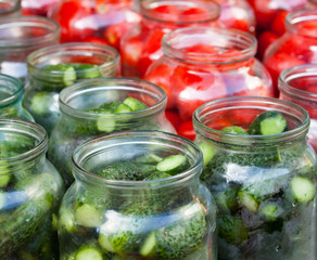 Fototapeta na wymiar Pickling (canning) tomatoes and cucumbers.