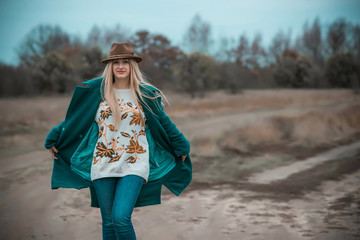 Woman of plus size, American or European appearance walks and enjoying life. A young lady with excess weight, xl size at the park. Natural beauty