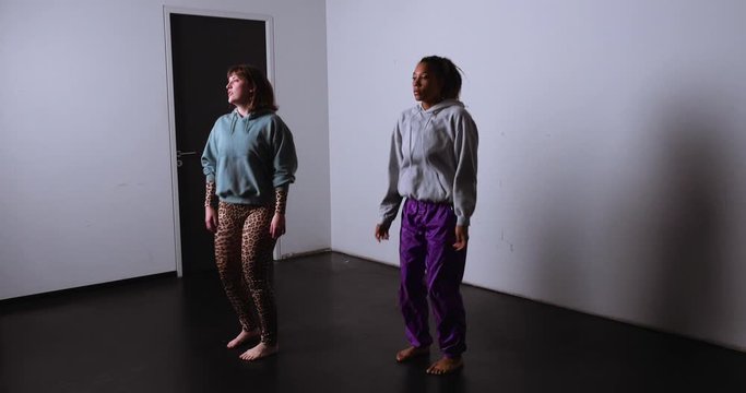 Two Dancers Rehearsing and Stretching at Audition