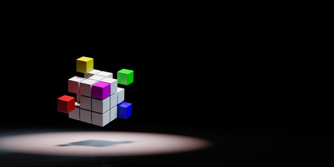 Obraz premium Combining Multicolor Cubes Spotlighted on Black Background