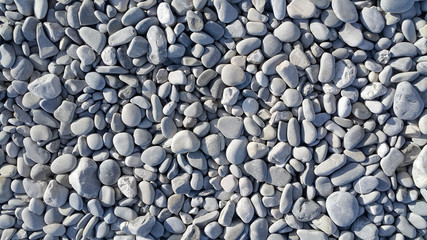 Nature background from gray sea pebbles