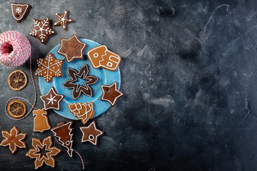 Various decorated gingerbread cookies on a plate