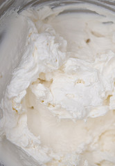 White cream for the cake. Cooking a cake in the kitchen in a restaurant or bakery. The chef creates a delicious dessert for the coffee shop.