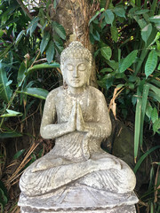 White statue of Buddha praying in Bali, Indonesia