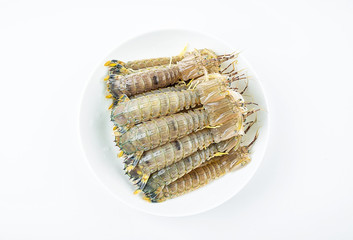 Fresh pip shrimp on a plate on white background