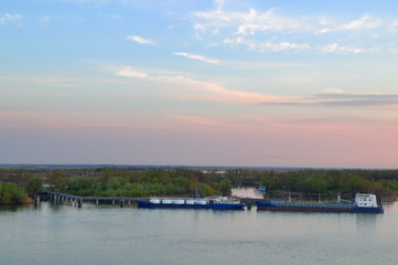 Fototapeta premium A tanker offloads oil into the vault