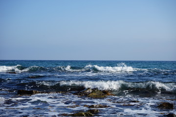 waves breaking on the rocks on the seashore