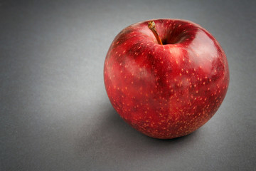 Red apple on a dark background