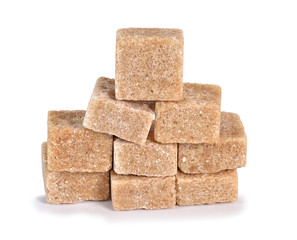 Cane sugar cubes on a white background