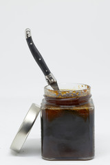 man catching honey with spoon