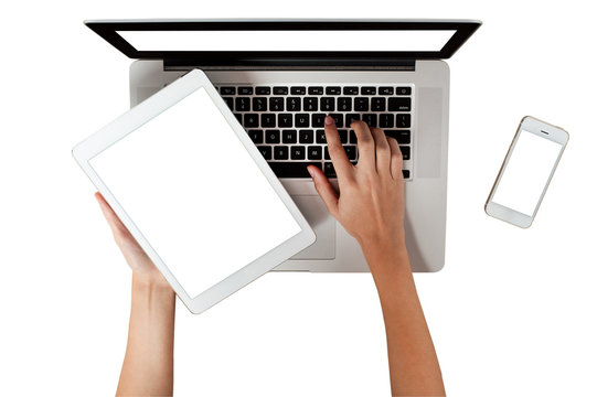 hand holding digital tablet and laptop blank frame