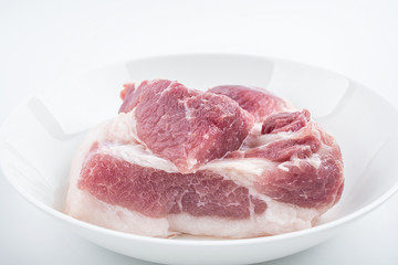 Piece of fresh pork on white background