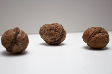 Three Walnuts in a white background, isolate, healthy food