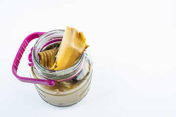 Pickled golden sour mustard with chopsticks on white background