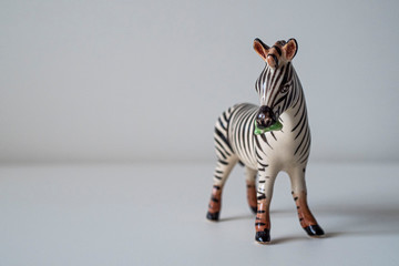 porcelain zebra figurine on a white background