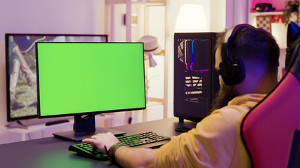 Over shoulder footage of man playing video games © DC Studio