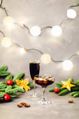 Christmas composition with lights and glasses.