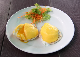Eggs Benedict- toasted English muffins, poached eggs, and delicious buttery hollandaise sauce