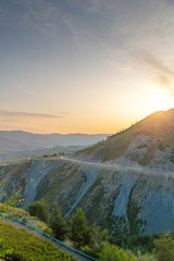 Colorful sunrise behind mountains landscape