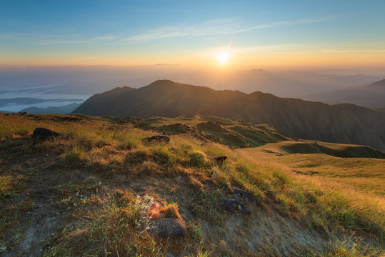 Rising sun with colorful skyline over the mountains in early morning, Natural summer landscape, Mulayit Taung, Moei Wadi, Myanmar