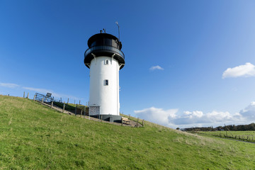 Fototapeta na wymiar historic lighthouse called ‘Dicke Berta’ (‘Thick Berta’) in Cuxhaven-Altenbruch, Germany