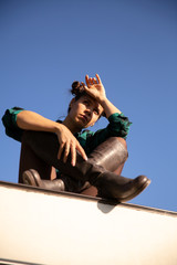 Young girl with serious faces on the roof of a retro camper