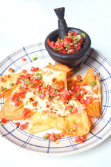 A plate of nachos and cheese