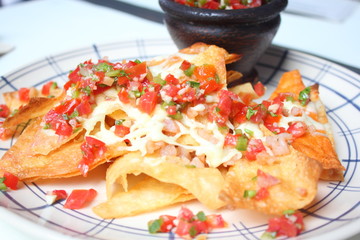 A plate of nachos and cheese