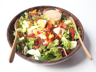 Healthy Salad with Dressing in Wood Bowl