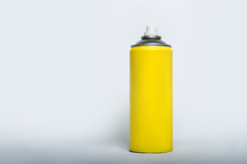 Yellow spray can for spray on a white background. No inscriptions.