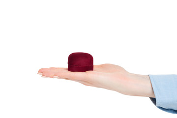 Open female palm with a red jewelry box. Present. Isolate
