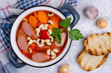 Stewed beans with sausages