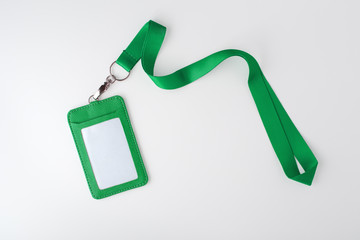 Green lanyard and leather badge