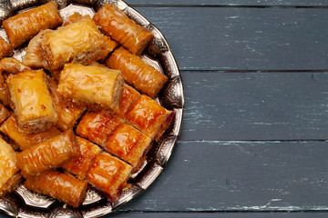 Plate of baklava dessert close up served on table
