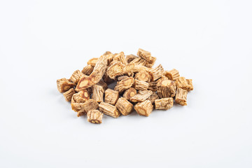 A pile of Chinese herbal medicine windbreak on white background