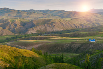Landscape of alpine meadow with sunrise scenery