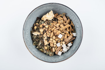 Chinese medicine concept illustration / bowl of chinese medicinal herbs on white background
